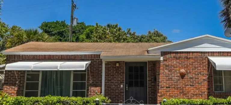 Louisville brick house representing local neighborhood property differences