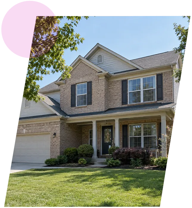 Two-story suburban brick house with an attached garage and green lawn in Lyndon, Kentucky.