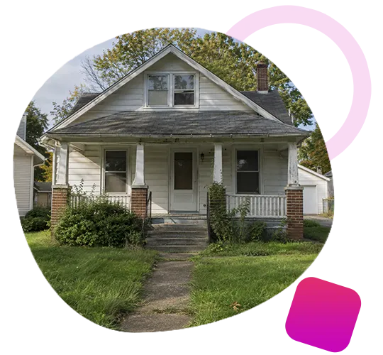 One-story white cottage home with front porch and peeling siding in Shepherdsville, Kentucky.