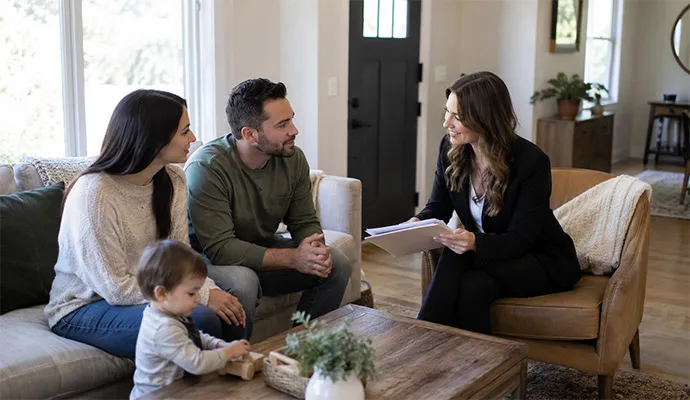Tenant family reviewing rental documents with buyer inside occupied Louisville KY rental property